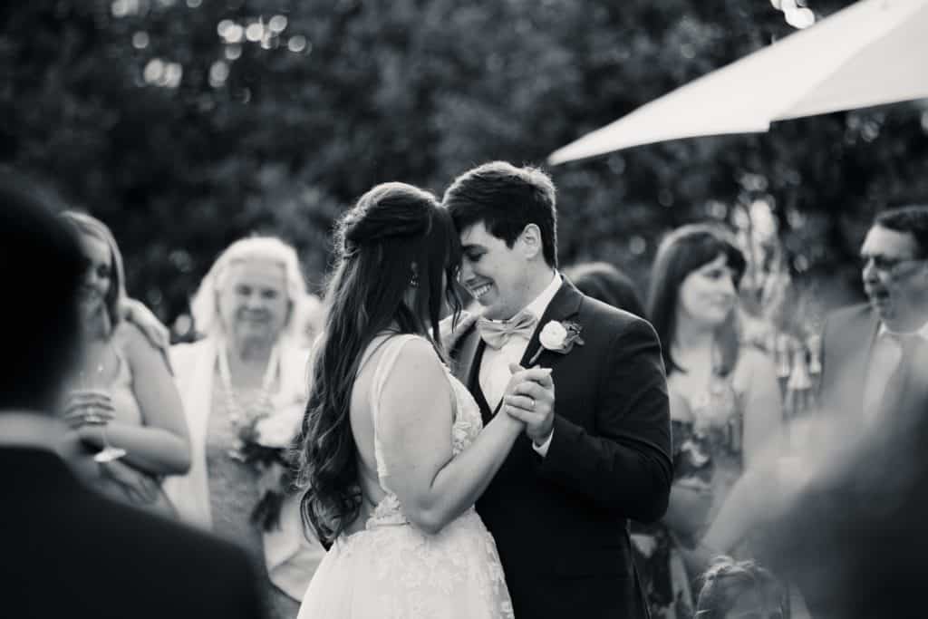 Man and woman dancing at their small wedding