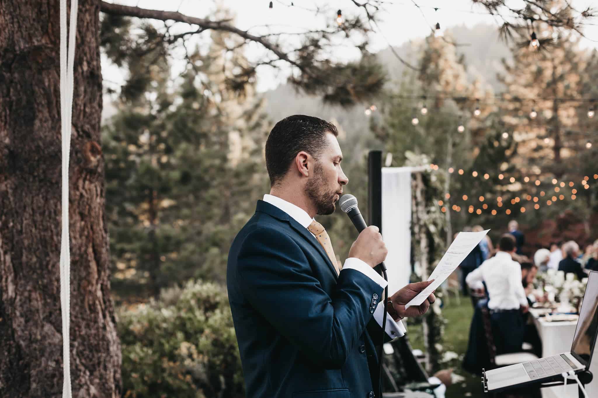 Lake Tahoe Wedding DJ speaks into the microphone at a wedding