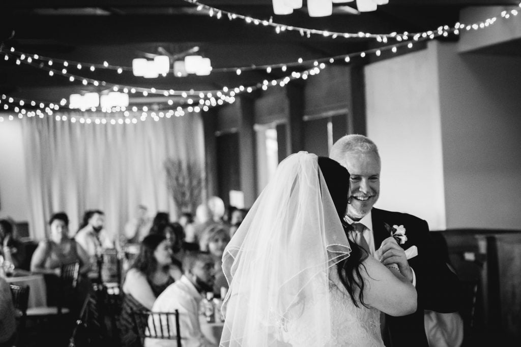 Black and white photos of a bride and her father during the father-daughter dance.